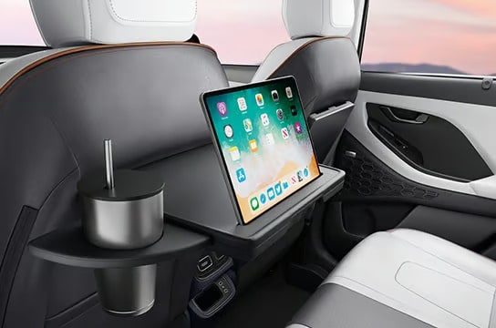 Front row seat back table with IT device holder & retractable cup holder